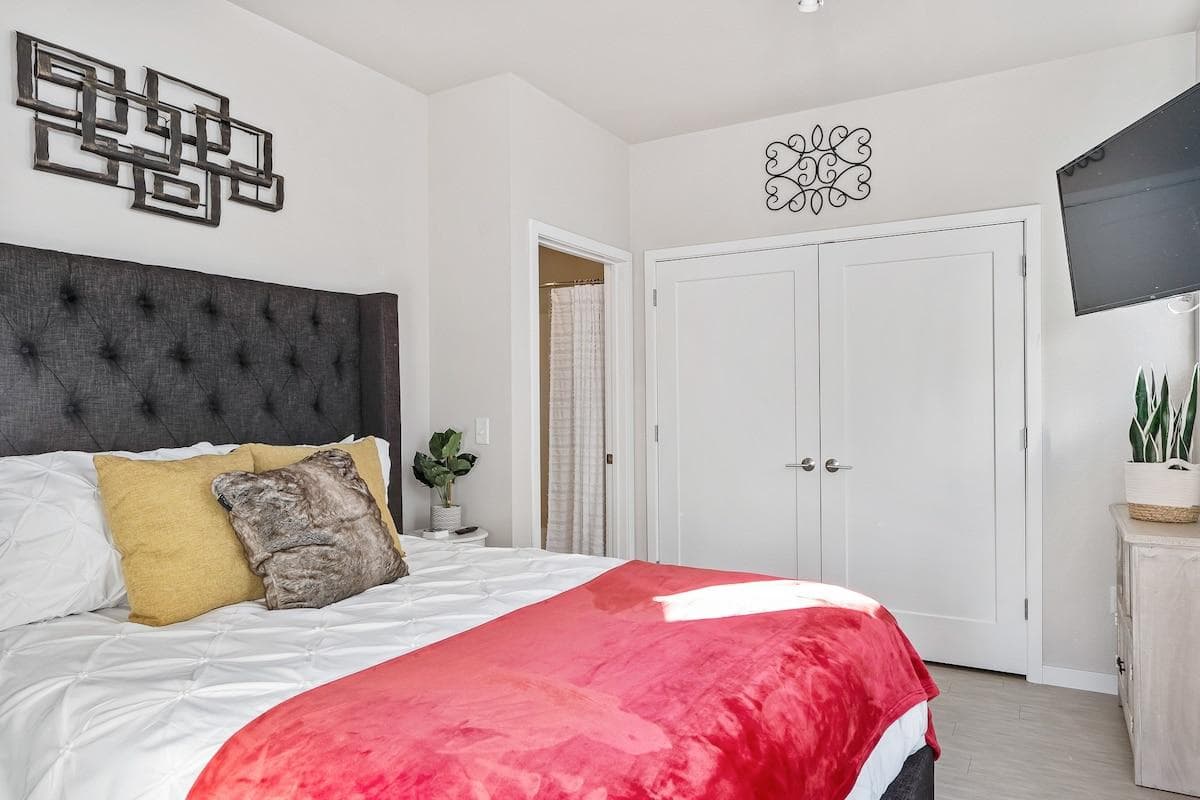 Bedroom with King bed and TCL 4K HD Roku TV. 