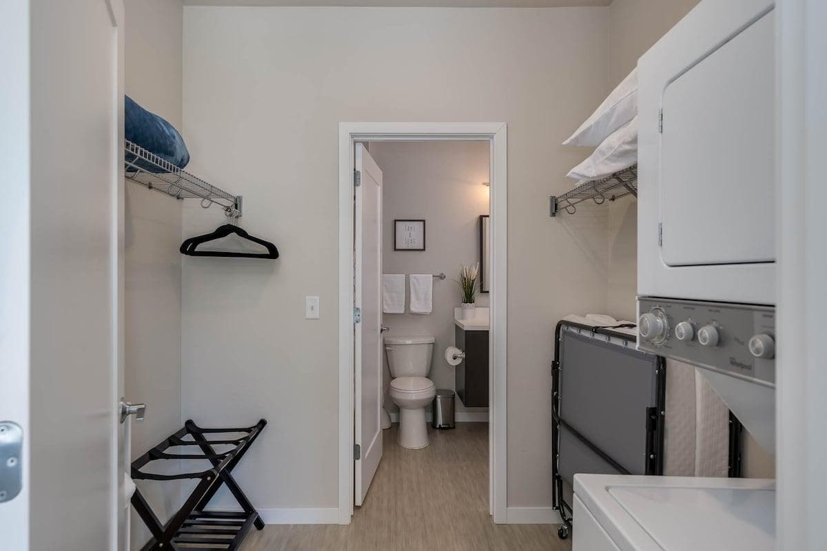 Walk through closet with washer/dryer 